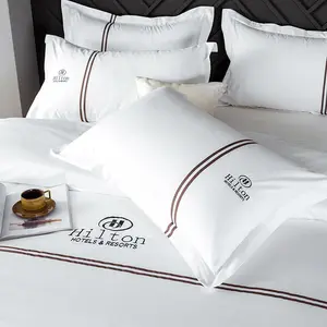 ชุดเครื่องนอนฮิลตันแบบกำหนดเอง,ชุดเครื่องนอนโรงแรมมีโลโก้ที่กำหนดเองพร้อมผ้านวมคลุมเตียงแบบเปลือยกายสำหรับโรงแรม