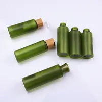 पर्यावरण के अनुकूल स्किनकेयर बांस कॉस्मेटिक पैकेजिंग के साथ हरी पीईटी बोतल