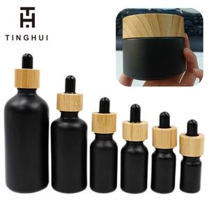 30ml 60ml 100ml 1 oz Black Matte <b>Dropper</b> <b>Bottles</b> 30g 50g 100g Black Matte Frosted Glass Jar with Faux Bamboo Top - Product Image 1