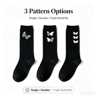 Chaussettes mi-mollet pour femme en jacquard papillon phosphorescent OEM, style streetwear, toutes occasions, chaussettes décontractées en tricot noir, logo personnalisé