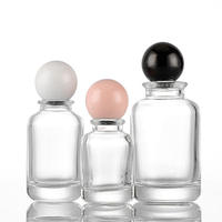 30ML 50ML 100ML Botellas de perfume de vidrio redondas multiespecificación con 15 tapas de bayoneta empaquetadas en tapas de bola de madera de colores