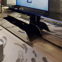 Meuble TV contemporain inspiré des formations karstiques, laque noire, acier inoxydable laqué, laiton poli, meuble de rangement pour téléviseur