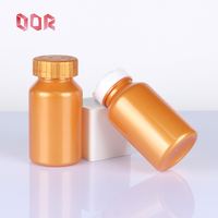 PET Orange Food Grade 200ml Suplemento Cápsulas de vitamina Tableta Botella de plástico con tapa superior abatible personalizada Tapa metálica