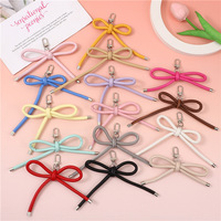 Porte-clés en cuir PU multicolore avec breloque créative en forme de nœud papillon, design corde suspendue, accessoire décoratif pour clés pour femmes