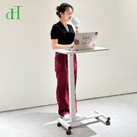 Bureau mobile pneumatique blanc réglable en hauteur avec chariot roulant pour ordinateur portable, idéal pour le télétravail et le bureau à domicile