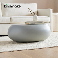 Table basse moderne en béton durable, forme pierre, pour balcon et terrasse d'hôtel, idéale pour un usage quotidien