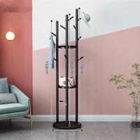 Porte-manteau sur pied moderne en fil métallique pour la maison et les salles de bain d'hôtel, idéal pour accrocher les vêtements comme un arbre