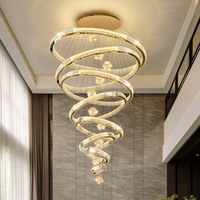 Lustre en cristal pour villa duplex, escalier circulaire multi-cercles, lampe suspendue décorative en acier inoxydable pour salon luxueux