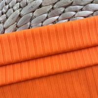 Tissu en tricot côtelé extensible en polyester pour vestes d'automne/printemps pour femmes manches courtes et robes.