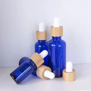 Botella cuentagotas de bambú de vidrio azul 5ml 10ml 15ml 20ml 30ml 50ml 100mL Calibre 18mm botella de vidrio Europea redonda para aceite esencial