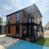 Maison conteneur préfabriquée modulaire portable et extensible à double étage et double ailes, directement de l'usine, avec intérieur moderne et respirant, idéale pour salle de sport ou habitation