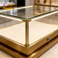 Petite vitrine de comptoir en métal doré avec éclairage LED intégré, écologique, pour présentation de montres et bagues en diamant en showroom