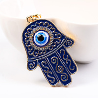 Porte-clés main Hamsa en émail à la mode exquis avec porte-clés de décoration de sac en alliage incrusté de strass de conception du mauvais œil