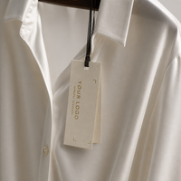 Étiquettes suspendues géométriques de luxe personnalisées en or estampé pour vêtements féminins, étiquettes en papier gaufré à chaud pour robes, vente en gros