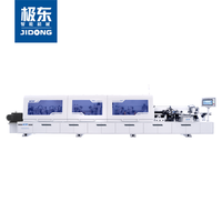Machine à chantourner les bords KDT KE-493ZU (40), avec support d'alimentation, stable et efficace, répondant à des besoins variés.