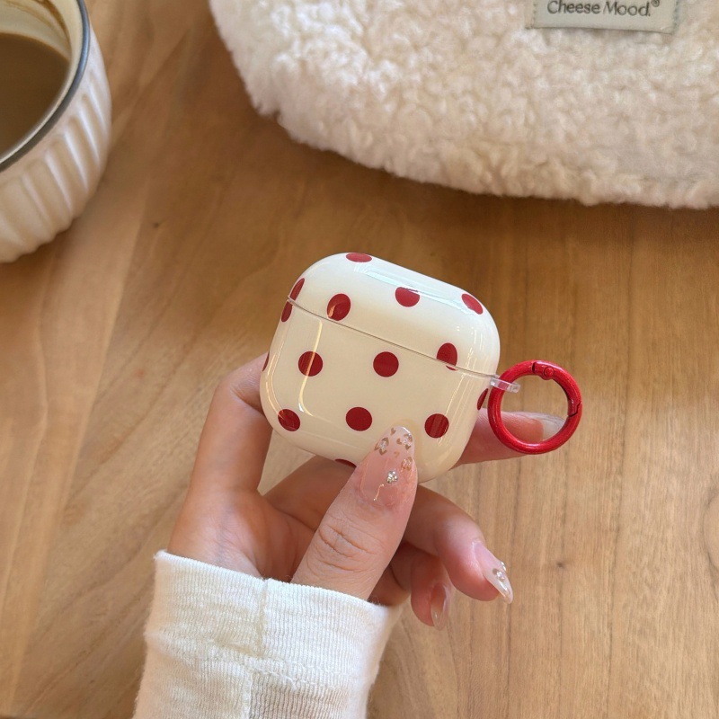 Cream white with red polka dots, ring