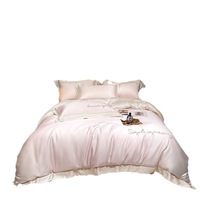 Parure de lit quatre pièces en Tencel Lenzing, style minimaliste luxe léger, soyeuse et douce, pour un sommeil nu, comprenant housse de couette et draps-housses