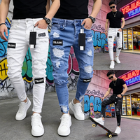 Fabricant de denim YSJY, pantalon personnalisé déchiré et usé, badges, patchs artistiques, jean skinny biker blanc, pantalon slim pour homme