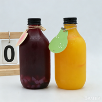 Bouteille de jus en PET de qualité alimentaire 350 ml 500 ml, bouteille de boisson ronde vide avec bouchon à vis noir pour thé au lait, boissons aux fruits