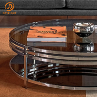 Table basse ronde à double niveau avec rangement, plateau en verre trempé noir et structure circulaire en acier inoxydable, style contemporain