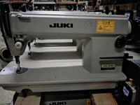 Machine à coudre industrielle à plat à entraînement direct à aiguille simple JukiS DDL-5550 d'occasion