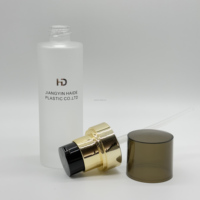 Offre spéciale couvercle en croix dorée couvercle semi-transparent noir bouteille en verre dépoli pompe à lotion
