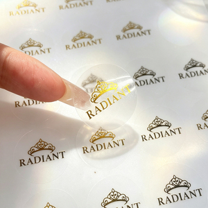 สติกเกอร์ปั๊มร้อนสีทองทรงกลมใส พิมพ์โลโก้แบรนด์ตามสั่ง ฉลากกาวสำหรับกล่องเครื่องสำอางและถุงของขวัญ - Product Image 1