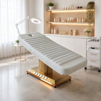 Lit de beauté électrique à 3 moteurs, colonne dorée brossée, base lumineuse LED chaude, trou pour le visage, pour thérapie, salon, spa, microblading, clinique