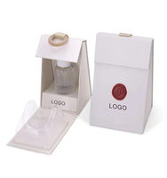 Boîte d'emballage triangle unique personnalisée Boîte de parfum Impression de logo Élégance Sens du design avec huile essentielle Boîte d'emballage pour bougie
