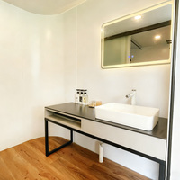 Vente chaude Maison préfabriquée en acier préfabriquée en forme de capsule spatiale Conteneur d'expédition Hôtel Maison de vacances miniature personnalisée Bureau pour complexe hôtelier
