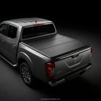 Nouvelle couverture de benne rigide pliable en trois parties en alliage d'aluminium, étanche et anti-poussière, pour Navara NP300/Frontier/Hilux Revo/Rocco/GWM (modèle 2026)