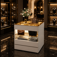Cremefarbener, umweltfreundlicher, langlebiger Schmuck-Präsentationswürfel mit LED-Glasplatte, offener Inselregal-Organizer, Thekenvitrine mit zwei Schubladen