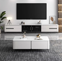 Ensemble de meuble TV et table basse modernes haut de gamme pour petits appartements, avec un support TV sur pied mobile et durable.