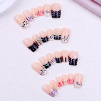 Faux ongles à porter, longueur moyenne, rectangulaires, à rayures et pois, avec étoile à cinq branches et nœud, style Y2K