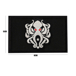 Toppe ricamate con fior Morale legate al gioco di Breakout della zona scura oro nero fascia internazionale con bracciolo bianco lupo squadrone - Product Image 3