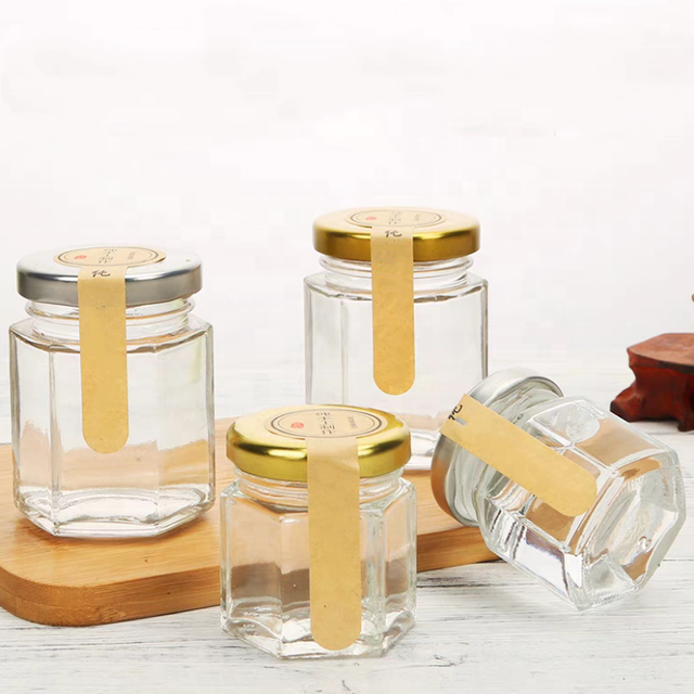 China Supplier 45ml 730ml 1000ml Clear Empty Hexagon Glass Jam Jars and Bottles Luxury Glass Food Storage Honey Jar Wholesale