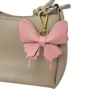 Porte-clés papillon mignon en cuir PU, 6 couleurs, pendentif pour sac à main pour femme, accessoire de mode de haute qualité et durable - Product Image 2