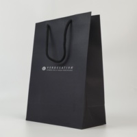 Sacs shopping en papier personnalisés avec logo, sacs cadeaux noirs de luxe avec poignées pour l'emballage de vêtements de boutique