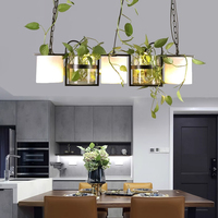 Table de salle à manger commerciale créative pour restaurant, avec comptoir de bar et lustre hydroponique à trois têtes pour plantes, style original pour magasin