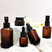 Épaule en pente ambre noir ensemble de soins de la peau bouteille de lotion contenants d'emballage de cosmétiques avec pot compte-gouttes noir avec couvercle