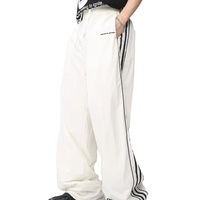 Broderie personnalisée Patch logo 100% Nylon pantalon de survêtement droit jambe large baggy pantalon de survêtement bouton pression latéral pantalon en nylon pour hommes