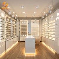 Conception d'intérieur complète pour magasin d'optique moderne, vitrine d'exposition de lunettes éclairée par LED pour opticien