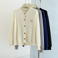 Automne et hiver grand pull tricoté cardigan brodé coeur bouton bas pull pour les femmes