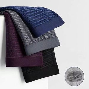 Shu Fei Yan OEM/ODM Calzoncillos bóxer de seda helada sin costuras para hombre, transpirables, antibacterianos, de tejido de punto, de tiro medio, con malla hueca - Product Image 1