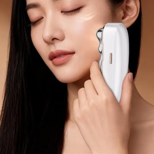 Ensemble de masseur facial électrique 4-en-1 avec têtes interchangeables pour le visage, le soin du cuir chevelu, le Gua Sha, le soin du corps entier et la relaxation musculaire - Product Image 3