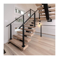 Escalier contemporain à poutre simple en bois avec balustrade en verre