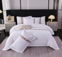 Ensemble de literie d'hôtel de luxe OEM avec logo personnalisé, bordure en jacquard doré, ensemble de literie classique blanc et noir avec rayures brodées