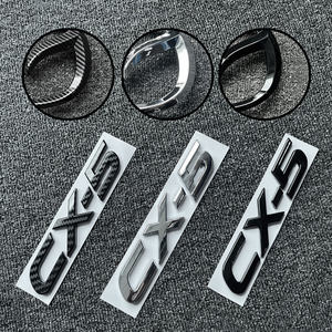 Emblema para Maletero Delantero de Coche para <span class=keywords><strong>Mazda</strong></span> <span class=keywords><strong>CX</strong></span>-<span class=keywords><strong>5</strong></span> <span class=keywords><strong>CX</strong></span>-50 CX30, Insignia para Volante, Adhesivo 3D de Repuesto para Carrocería, Decoración para Modificación de la Parte Trasera - Product Image 1