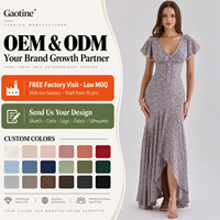 Robe longue d'été personnalisée OEM ODM pour femme, imprimé floral lilas, col en V, buste à nouer, manches volantées, coupe asymétrique, volants, vente en gros