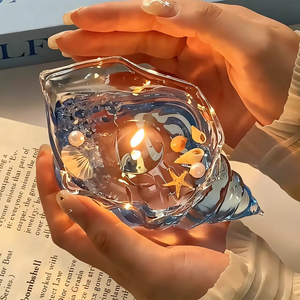 Bougie en cire de gel longue durée en forme de conque, parfumée aux senteurs uniques de coquillages marins, pour la décoration de salles de fête et comme accessoire photo - Product Image 1
